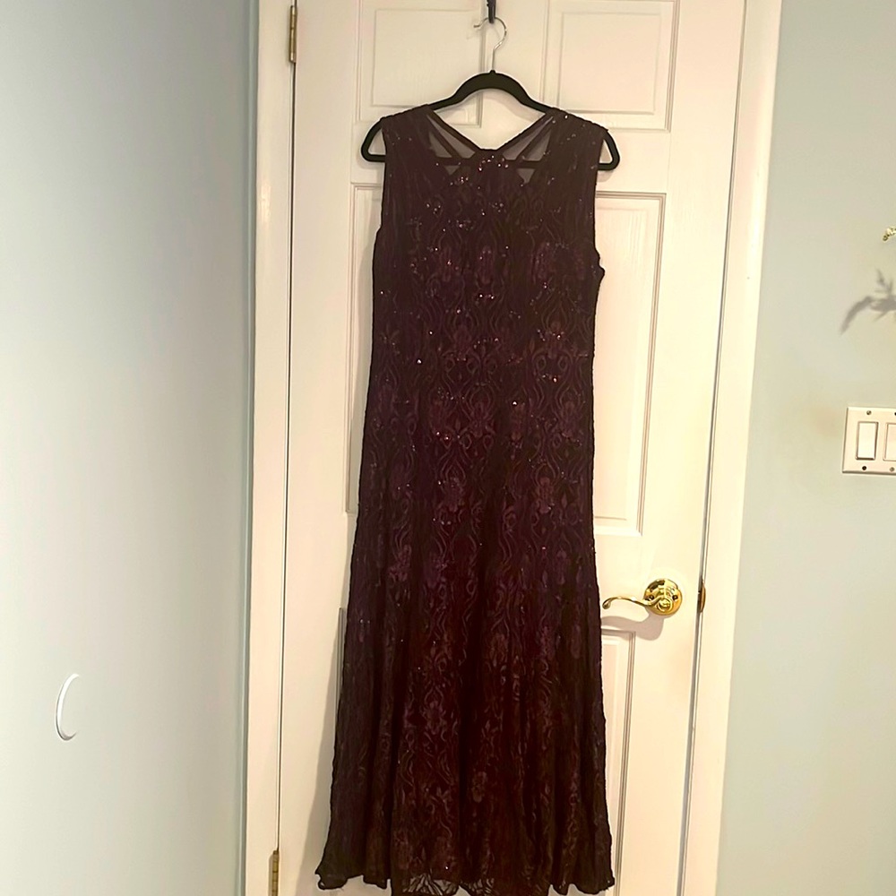 Beautiful lace with same color sequins evening gowns.  Very flattering shape .